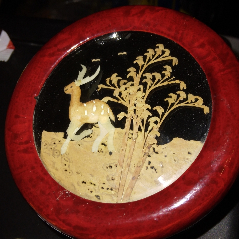Red lacquer Chinese jewelry box with bamboo art.